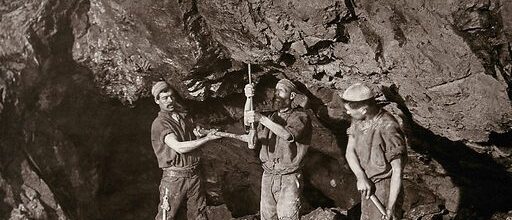 A tin mine, Camborne, Cornwall: three miners at work in a mine shaft. Photograph by J. C. Burrow, 1890/1910. Created 1890-1910. Contributors: J. C. Burrow (1852-1914).